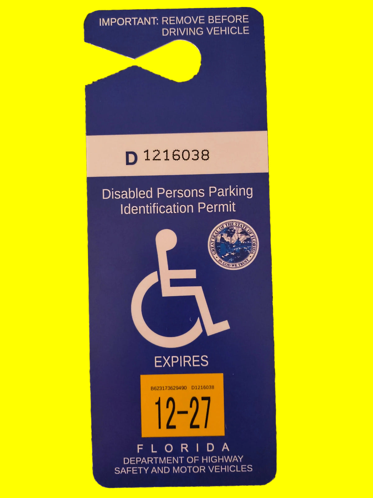 A blue Florida disabled persons parking permit card with white text and a yellow expiration sticker.
